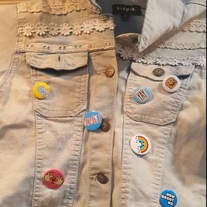 Light blue denim jacket with adorable pins